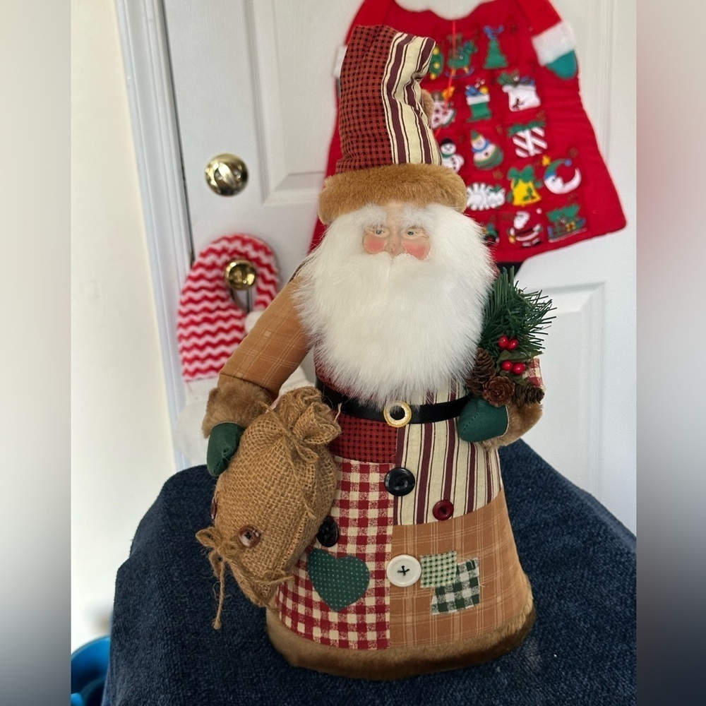 Santa tree topper in shades of browns & reds. Made of fabric.